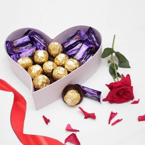 20 Pieces Dairy Milk Mini Bars with 9 Pieces of Ferrero Rochers in a purple heart shaped box along with Single Red Rose